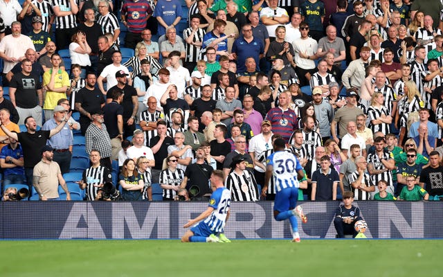 Newcastle fans look on as Brighton’s Evan Ferguson celebrates scoring his second goal