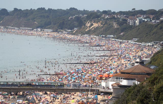 People enjoying the hot weather at Bournemouth beach in Dorset