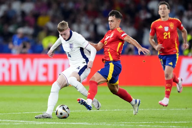 England’s Cole Palmer and Spain’s Martin Zubimendi (right) battle for the ball during the Euro 2024 final 