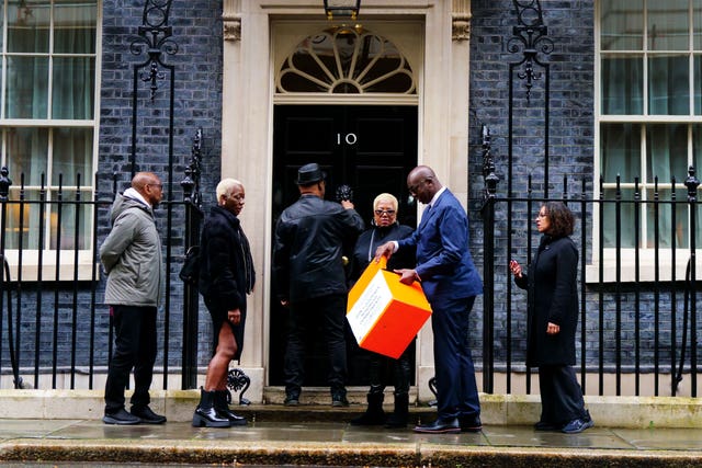 Windrush campaigners handing in a petition to 10 Downing Street