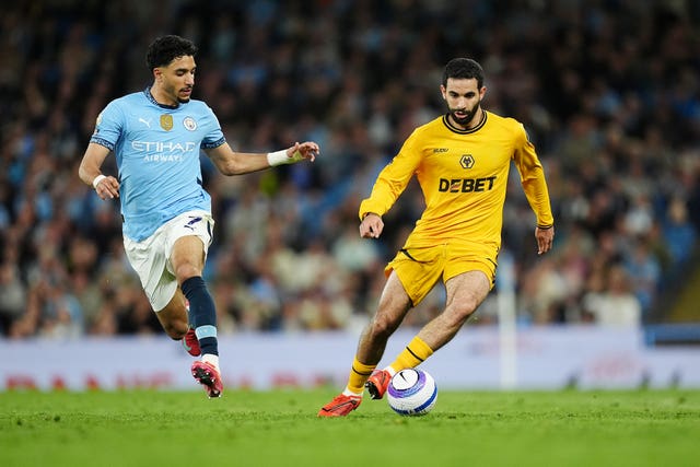 Wolves defender Rayan Ait-Nouri dribbles away from Manchester City's Omar Marmoush