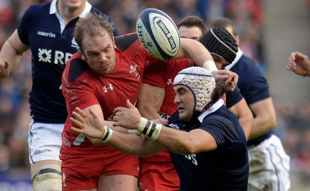 Alun Wyn Jones tackles Scotland's Blair Cowan, right, and jars the ball loose