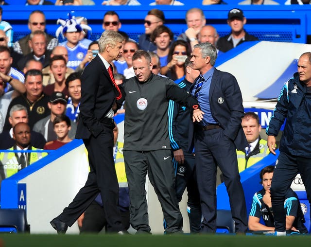 Arsene Wenger, left, and then Chelsea manager Jose Mourinho had to be separated in October 2014