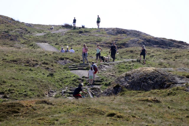 Walkers practice social distancing on Dumyat  (Andrew Milligan/PA)