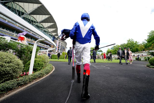 Frankie Dettori walks back after a race to forget with Lord North