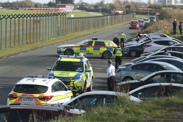 Airport police question motorists at a site popular with plane spotters