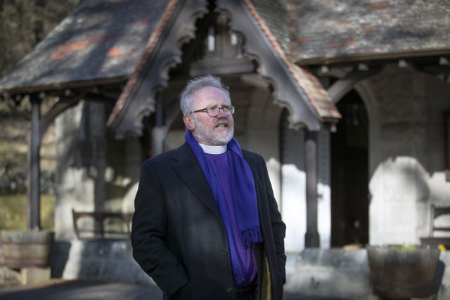 Reverend Ken MacKenzie, domestic chaplain to the King, outside Crathie Kirk near Balmoral Castle 