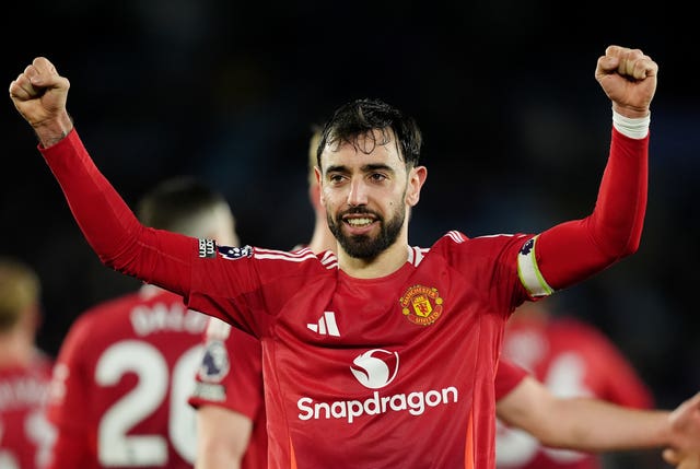 Bruno Fernandes with his arms raised