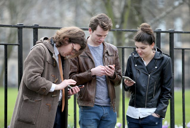 People on smartphones