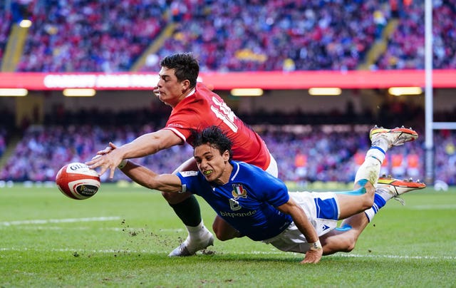 Ange Capuozzo, right, and Louis Rees-Zammit compete for the ball during Italy's shock 22-21 Six Nations win over Wales in Cardiff. The Azzurri broke their seven-year losing sequence in the tournament after a superb break from Capuozzo set up a last-gasp try for Edoardo Padovani. Following just 13 wins from 34 Test matches under his leadership, Wayne Pivac left his role as Wales head coach earlier this month. Warren Gatland, who was in charge of Wales between 2007 and 2019, returned as Pivac's replacement