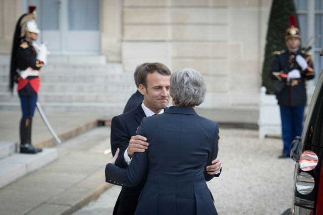 Mr Macron greets Mrs May in Paris