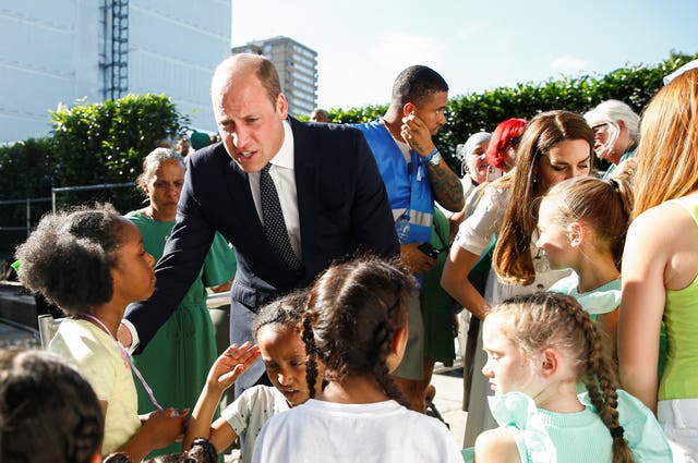 William and Kate speak to children during the service