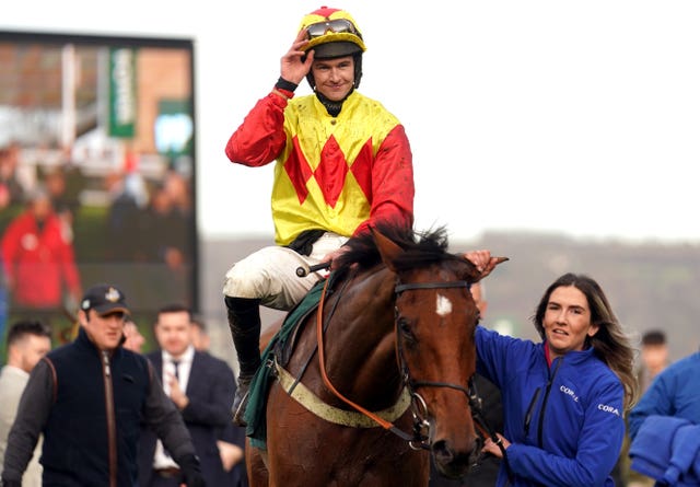 Jockey Brendan Powell celebrates winning aboard Triple Trade 
