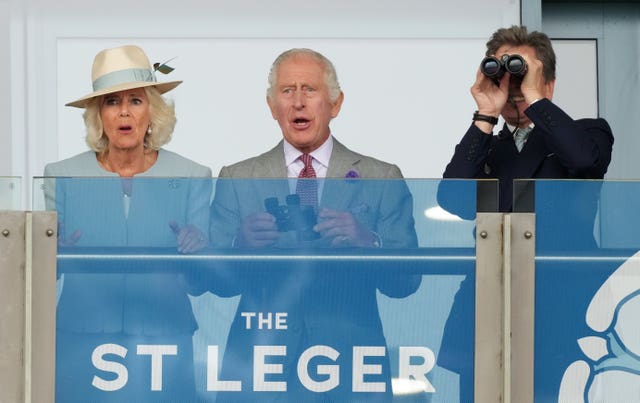 The King and Queen watch on with excitement at Doncaster