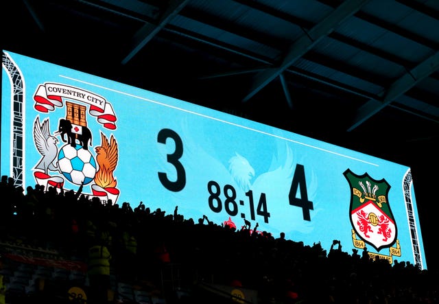 The score is shown on screen towards the end of the Wrexham's win at Coventry (Barrington Coombs/PA).