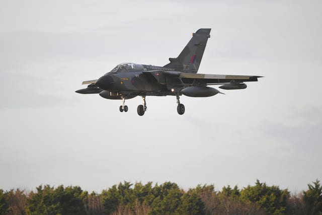 An RAF Tornado GR4 with a specially painted livery to commemorate the aircraft’s retirement from service comes in to land at RAF Marham in Norfolk