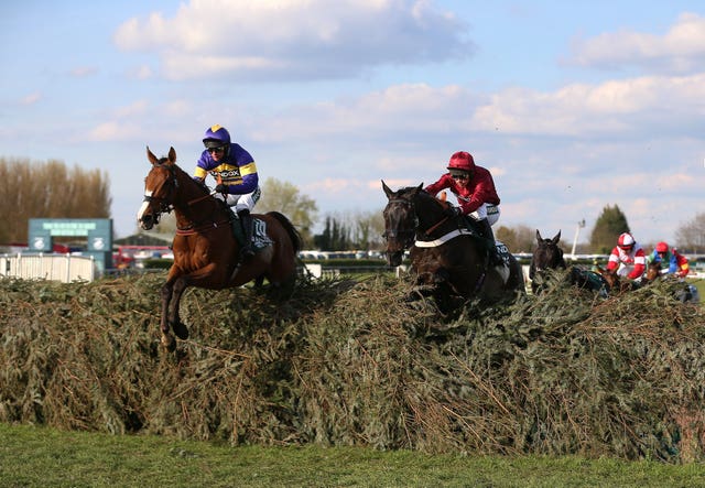 Corach Rambler (left) jumps the last on his way to Aintree glory 