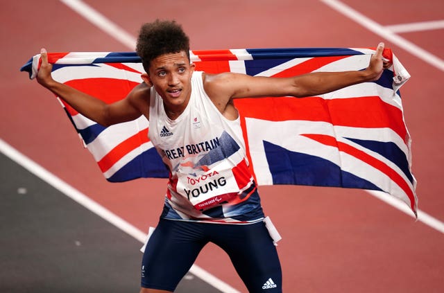 Thomas Young celebrates winning gold during the men's 100m – T38