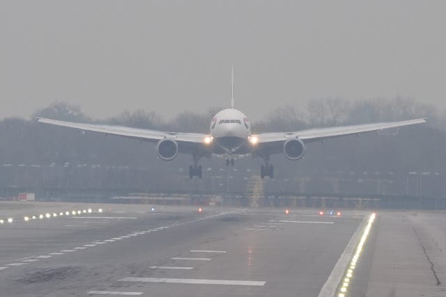 A plane in the fog width=