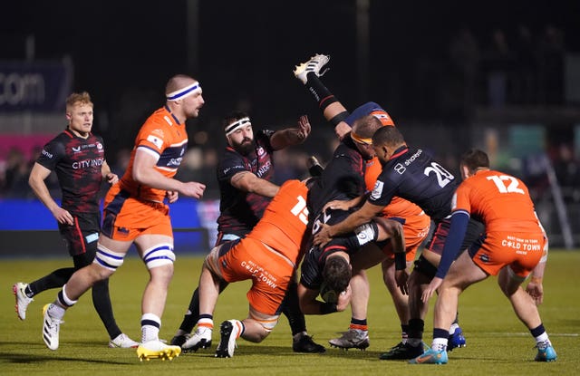 Saracens’ Callum Hunter-Hill tackled by Edinburgh’s Sykes Marshall (left)