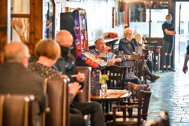 Customers inside The Borough pub on St Mary’s Street, Cardiff (Ben Birchall/PA)