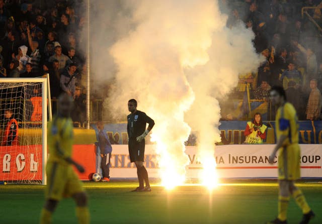 Robert Green looks away as flares are let off during England's match against Ukraine in Dnipropetrovsk (Owen Humphreys/PA).