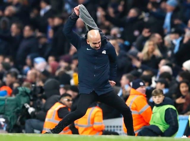 Manchester City manager Pep Guardiola throws his scarf in anger during a tense clash