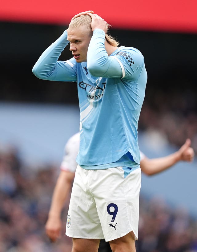 Manchester City’s Erling Haaland reacts to a missed chance against Brentford