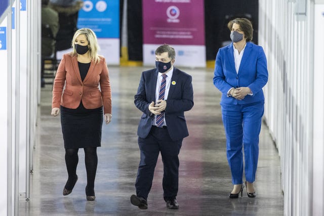 Northern Ireland Minister for Health Robin Swann with First Minister Arlene Foster (right), and deputy First Minister Michelle O'Neill