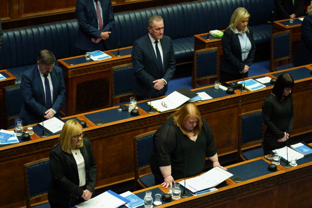 Ministers take part in a minute’s silence in the Northern Ireland Assembly chamber at Stormont before the delivery of the long-awaited public apology to the victims of historical institutional abuse 