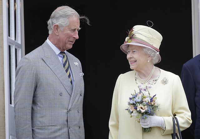 King Charles III, left, with the Queen