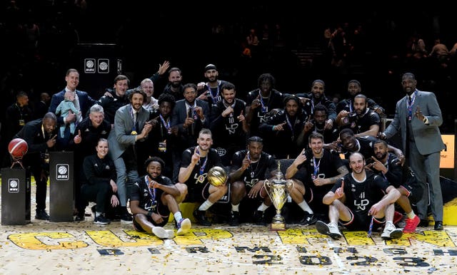 London Lions players celebrate with the BBL Trophy