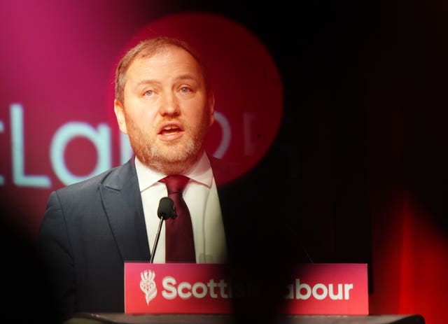 Ian Murray speaking from lectern