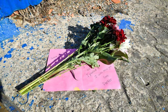 Flowers left beside a slipway leading to the River Teifi in Cardigan, Wales, near the scene where two-year-old Kiara Moore was recovered from a car that had plunged into the river (Ben Birchall/PA)
