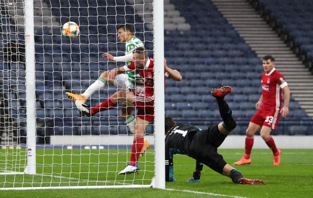 Mohamed Elyounoussi, left, scores Celtic's second goal on Sunday to edge them closer to a quadruple treble