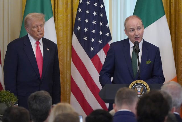 Taoiseach Micheal Martin and US President Donald Trump during the St Patrick’s Day Reception and Shamrock Ceremony in the the East Room of the White House