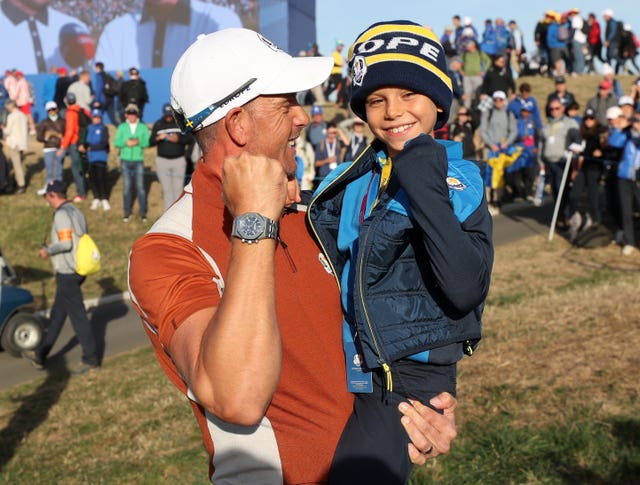 Henrik Stenson with son Karl after securing another point for Europe