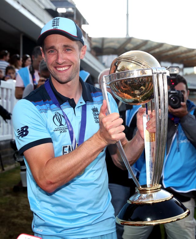 Chris Woakes celebrates with the World Cup trophy after the 2019 final at Lord's