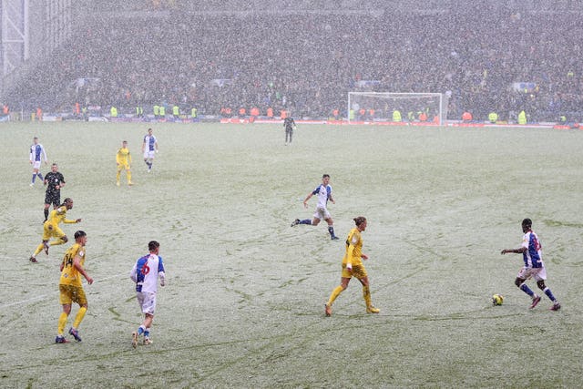 Blackburn Rovers and Preston play a match in the snow