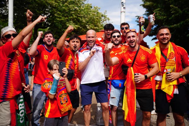 Spain fans with an England supporter