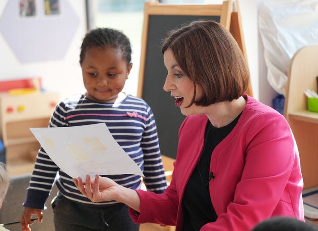 Education Secretary Bridget Phillipson is shown a painting by a pupil