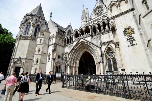 The pair's cases were dismissed at the Royal Courts of Justice (Nick Ansell/PA)
