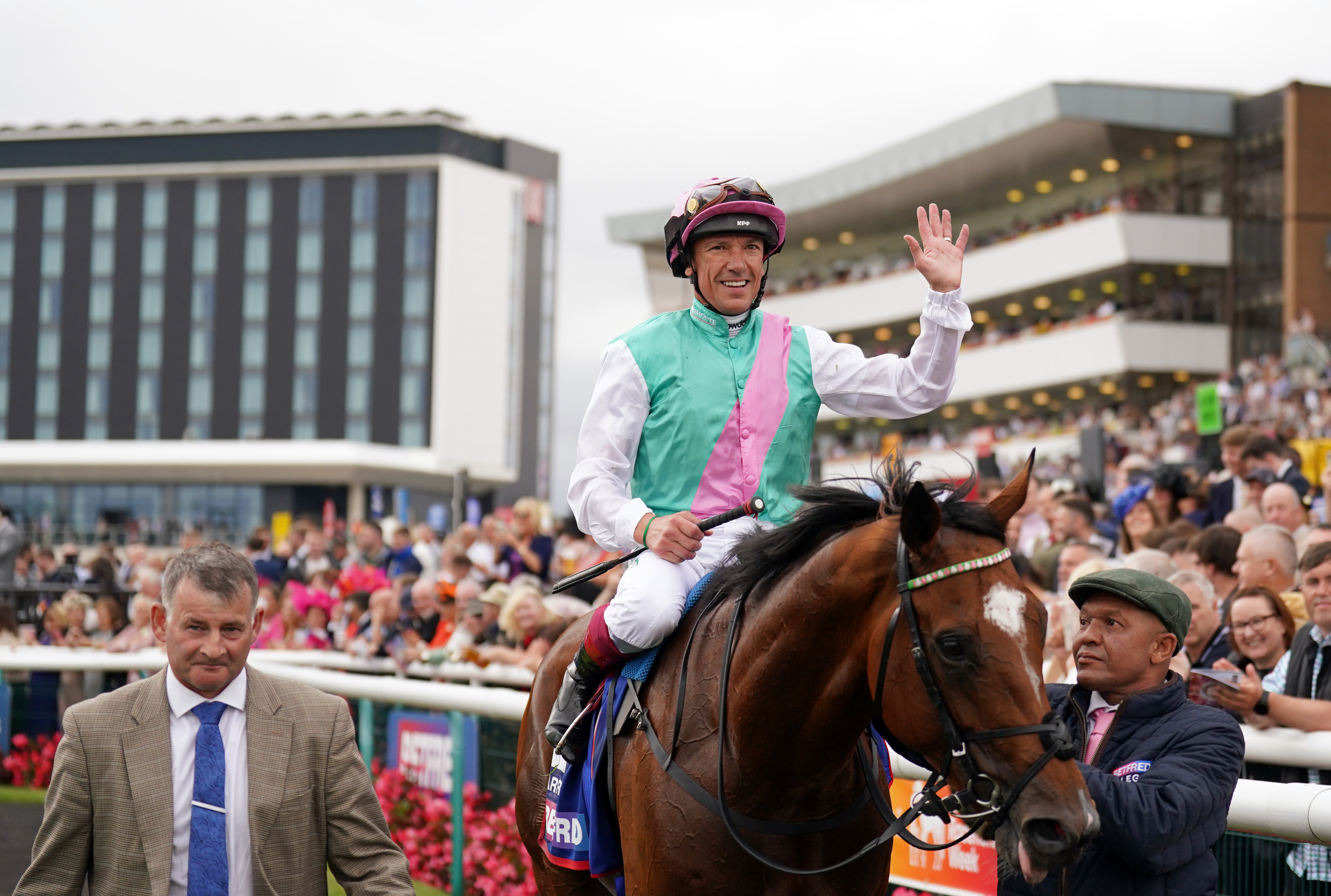 Frankie Dettori waves to the crowd after the Betfred St Leger