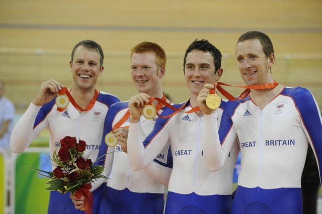 Paul Manning, Ed Clancy, Geraint Thomas and Bradley Wiggins with their Gold Medals after winning the Men’s Team Pursuit