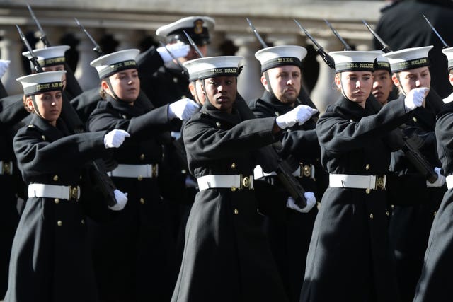 Royal Navy personnel march