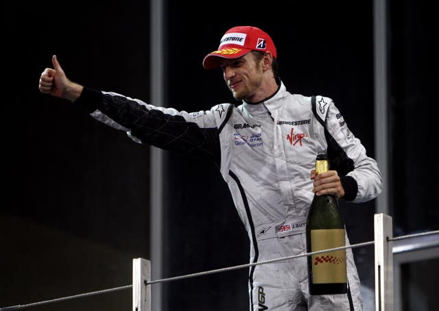 Brawn GP’s Jenson Button celebrates his third place during the Abu Dhabi Grand Prix in 2009 