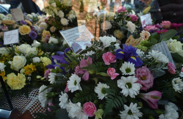 Flowers were laid in tribute outside the church 