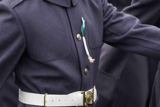 A member of the Welsh Guards wears a leek on their tunic 