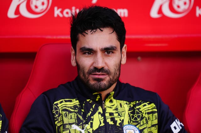 Manxhester City's Ilkay Gundogan sitting on the bench