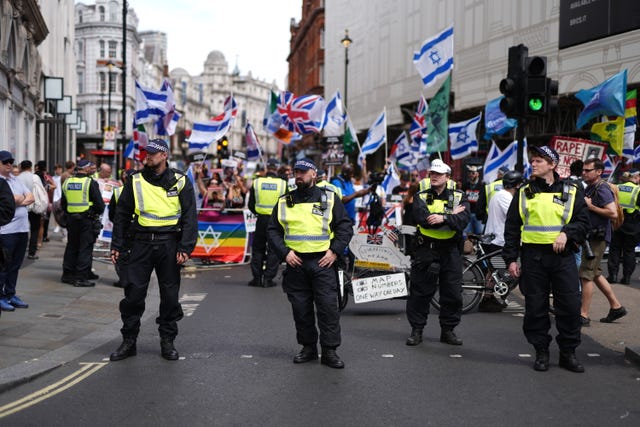 A heavy police presence as people take part in a Enough is Enough protest in Piccadilly Circus